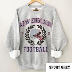 Perfect sweatshirt for New England football fans this season! Ideal for any situation, a unisex heavy blend crewneck sweatshirt is pure comfort. These garments are made from polyester and cotton. This combination helps designs come out looking fresh and beautiful. The collar is ribbed knit, so it retains its shape even after washing. There are no itchy side seams on these sweaters.  .: 50% cotton, 50% polyester .: Medium-heavy fabric (8.0 oz/yd² (271.25 g/m .: Loose fit .: Sewn-in label .: Runs Patriot Football, England Football Shirt, Vintage Bunting, Heat Press Printing, Patriots Football, Football Gift, England Football, Football Sweatshirt, Football Gifts