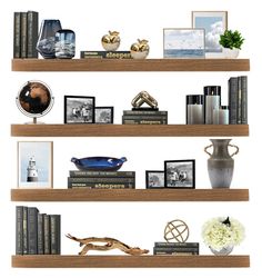 three wooden shelves with books, vases and other items on top of each shelf