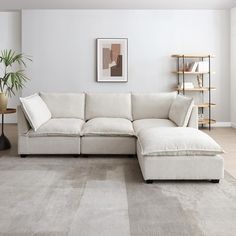 a living room with a large white sectional couch