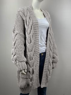 "It is a beautiful long cable knit cardigan that super comfortable and stylish for you! Features: * open front cardigan * oversize looking * large Cable knits on front and sleeves * Side seam pockets * drop-shoulder sleeves * chunky wool/acrylic blended yarn - 70% wool/ 30% acrylic - super soft and no itch at all Size: S(us 0-4) M(us 6-8) L(us 10-12)XL(14-16). Pls. choose size and color options. Measurements: Size S/ M: chest -51\"(130cm)，length -36\" (91cm) Size L/ XL: chest 55\"(140cm), length Oversized Long Chunky Knit Outerwear, Oversized Long Chunky Knit Cardigan, Oversized Gray Knitted Cardigan, Oversized Gray Chunky Knit Cardigan, Oversized Gray Knit Cardigan, Knitted Coat Pattern, Long Cable Knit Cardigan, Charcoal Cardigan, Cross Sweater