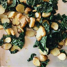 potatoes and spinach on a cutting board