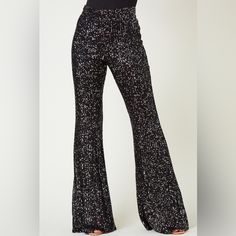 Classically-Styled Flared Leg Sequin Pants With Lined Interior Design, Ideal For Formal Occasion. Strike A Pose In These Sequined, Flared Pants Designed To Dazzle Any Special Event. The Full Lining Ensures Structure And Style. Condition: Brand New Color: Black True To Size Large: 30 Elegant Bottoms For Holiday Night Out, Elegant Holiday Bottoms For Night Out, Festive Pants For Party Season, Fitted Black Bottoms For Holiday, High Waist Holiday Party Bottoms, High Waist Pants For Party And Holiday, Glamorous Black Holiday Bottoms, Festive Black Sequin Bottoms, Glamorous Holiday Evening Bottoms