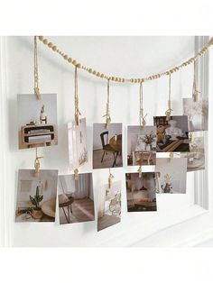 several pictures hanging on a string with gold beads and some photos hung from the wall