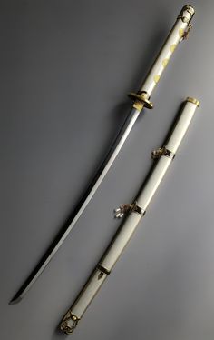 two white and gold colored swords on a gray background