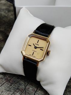 "Vintage women's gilded small watch . The watch looks very elegant on a woman's wrist and goes well with other accessories. This watch perfectly captures the vintage style! The watch will be a great gift for lovers of vintage accessories. The watch is delivered in a beautiful box, so it is perfect as a gift. Peculiarities Brand Name: Zaria Made in USSR. Movement - mechanical. Case size - 22 mm (0,8 inch) Strap:  eco-leather, length suitable for a wrist up to 17 cm  Year of issue - 1980s Case: gi Timeless Gold Watch For Anniversary, Timeless Gold Watch Accessories As A Gift, Timeless Gold Watch As A Gift, Timeless Gold Watch For Gift, Timeless Gold Watch As Gift, Elegant Gold Watch With Diamond Hour Markers, Classic Yellow Gold Jewelry For Evening, Timeless Watch With Gold Clasp As Gift, Classic Yellow Gold Watch Accessories For Gift