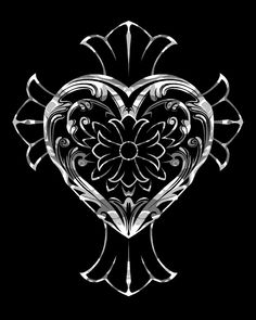 a heart shaped object on a black background with an ornate design in the middle and center