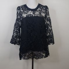 Open Back Lace Overlay Blouse. Nwot Arm To Arm 19" Length 27" Black Lace Top With Crew Neck, Black Lace Patchwork Tops For Evening, Party Blouse With Lace Top And Crew Neck, Black Lace Crew Neck Top, Black Lace Patchwork Blouse For Evening, Chic Lace Blouse With Crew Neck, Elegant Black Crew Neck Blouse, Elegant Black Blouse With Crew Neck, Black Lace Top With Lace Work