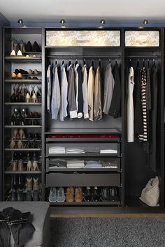 an organized closet with clothes and shoes