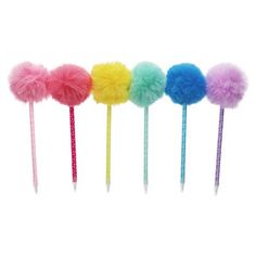 five pom - poms are lined up in a row