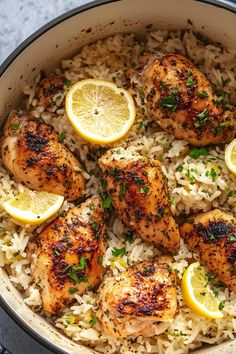 chicken and rice with lemons in a pan