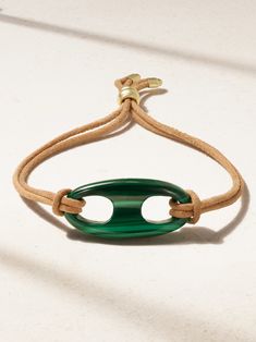 Jenna Blake Grosfeld is a self-proclaimed maximalist, so her label's eponymous pieces often play with color, shape and texture in such cool ways. Strung with a vibrant 'Nautical Link' malachite charm, this bracelet has a supple suede cord that can be easily adjusted using the 18-karat gold slider, so you can find your perfect fit. Timeless Green Bracelet As Gift, Designer Green Bracelets As Gift, Designer Green Bracelets For Gifts, Luxury Green Adjustable Bracelet, Suede Bracelet, Suede Cord, Designer Pieces, Fine Jewelry Bracelets, Top Designer Brands