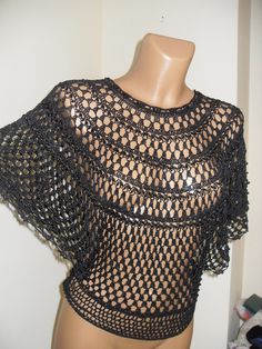 Bolero crochet of black silk with black pearls, cloak for official occasions size 38-40 EU, 8-10 USA Delivery up USA  to 7 business days Elegant Stretch Crochet Top For Party, Handmade Black Poncho For Festivals, Elegant Black Poncho Cape, Elegant Black Cape Poncho, Stretch Crochet Top For Party, Handmade Black Shawl Poncho, Black Stretch Crochet Top For Party, Handmade Black Poncho One Size, Fitted Black Crochet Top For Party