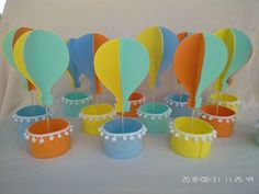 there are many colorful hot air balloons on the table