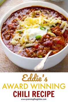 a bowl of chili with cheese on top and the title above it reads edible's award winning chili recipe