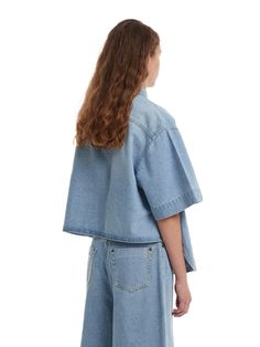 Editor's NotesTRUNK PROJEST's oversized denim shirt features a shirttail hemline. Make your outfit with this denim shirt trendy and casual.- Button closure- Spread collar- Flap pocket- Shirttail hem- Non-stretchy cottonMeasurements(in.)XXS/XS/S/L- Total length: 23.62 / 24.40 / 25.19 / 26.77 in.- Shoulder: 16.92 / 17.71 / 18.50 / 20.07 in.- Chest: 22.83 / 23.62 / 24.40 / 25.98 in.- Sleeve: 7.87 / 8.66 / 9.44 / 11.02 in.Model infoWoman - Height: 5'74 Fitting size LComposition & Care- 100% Light Wash Button-up Top With Frayed Hem, Spring Denim Blue Blouse With Pockets, Medium Wash Relaxed Fit Short Sleeve Denim Jacket, Summer Collared Denim Jacket In Relaxed Fit, Spring Medium Wash Collared Top, Washed Blue Button-up Top With Frayed Hem, Medium Wash Button-up Top With Frayed Hem, Trendy Collared Chambray Top, Spring Denim Jacket With Short Sleeves And Relaxed Fit