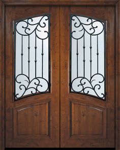 the double doors are made from wood and wrought iron