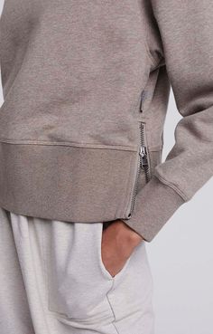 An elevated take on the classic pullover, the Eton sweatshirt features silver zippered side slits and a deep ribbed hem. Pair with leggings for barre class and wide leg jeans for brunch. This pullover runs large, we suggest sizing down one size. Relaxed Fit Zipper Sweatshirt In Athleisure Style, Relaxed Fit Athleisure Sweatshirt With Zipper Closure, Relaxed Fit Zipper Closure Sweatshirt For Athleisure, Athleisure Sweatshirt With Zipper Closure And Relaxed Fit, Relaxed Fit Zipper Sweatshirt For Athleisure, Sporty Fall Sweatshirt With Zipper Closure, Urban Sweatshirt With Zipper Closure For Fall, Zipper Closure Sweatshirt For Loungewear In Fall, Zipper Closure Sweatshirt For Fall Loungewear