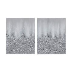 two silver and white paintings with trees in the background, one has snow flakes on it