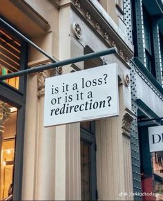 a sign on the side of a building that says is it a loss or is it a redirection?