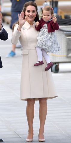 the duke and princess of cambridge wave as they walk with their baby daughter, charlotte