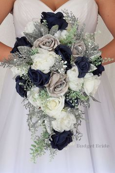 a bridal holding a bouquet of white and blue flowers