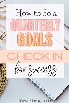 the words how to do a quarterly goals check in for success on top of a desk