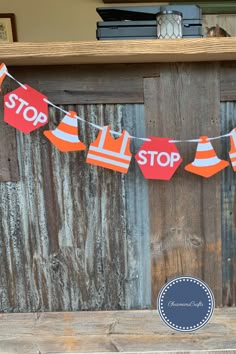 an orange and white stop sign hanging from a string