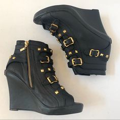 Ues Black Leather Gold Accents Wedge Bootie B16/17 -New Without Tags -Black Leather Upper -Exposed Gold Zipper On Inner Side -Open Toe -Straps Across Front With Gold Buckles & Accents -Heel Measures Approximately: 4 Inches -Platform Measures Approximately: 3/4 Inches Condition: New Without Tags, Excellent Condition, No Stains/Rips. Smoke Free Home. 5 Seller, Fast Shipper, Bundle Your Likes & Save $ #Evcx1021 B16/17 Edgy Black Leather Wedge Sandals, Black Leather Wedge Sandals With Reinforced Heel, Edgy Leather Wedge Sandals With Round Toe, Edgy Leather Round Toe Wedge Sandals, Edgy Leather Platform Wedge Sandals, Edgy Leather Wedge Heels, Chic Leather Wedge Sneakers, Designer Black Platform Wedge Sandals, Black Luxury Wedge Sandals With Round Toe