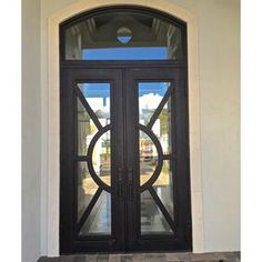 double iron door with clear glass and transom Entry Double Doors, Arched Transom, Porte In Ferro, Front Entry Door, Iron Front Door, Transom Window, Iron Entry Doors, Iron Door Design, Wrought Iron Design