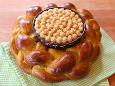 a pastry with some kind of topping on top of it sitting on a green napkin