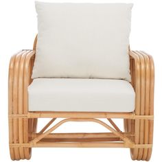 a wicker chair with a white pillow on it's back and seat cushion