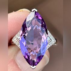 8.55ct Marquise Brazilian Amethyst With .11ctw White Zircon Rhodium Over Sterling Silver Ring. .72"L X .93"W. Finished Under Gallery. Accent Stones Primarily Zircon. Ring Attributes: Metal Weight2.61 G Band Width0.07 In Material Sterling Silver Finish Rhodium Primary Stone Amethyst Gemstone & Info If You Are Fortunate Enough To Be Born In February, Amethyst Is Your Birthstone. This Wonderful Member Of The Quartz Family Often Forms Large, Six-Sided Crystals. It's Usually Quite Clear And Can Be Cut Into Almost Every Shape, Which Makes It Ideal For Jewelry. Because Amethyst Is A 7 On The Mohs Scale Of Hardness, It's Very Wearable. Versatile Amethyst Offers A Wide Variety Of Shades, From Reddis White Gold Gemstones With Accents Fine Jewelry, Elegant Multi-stone Amethyst Gemstones, Purple Amethyst Gemstones With Diamond Accents, Classic White Gold Amethyst Gemstones, 14k White Gold Gemstones, Platinum Amethyst Ring In Fine Jewelry Style, Elegant Amethyst Gemstones With Diamond Accents, Platinum Amethyst Ring Fine Jewelry, Elegant Amethyst Ring In 14k White Gold