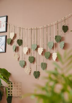 there is a wall hanging with leaves on it