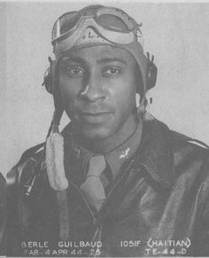 an old black and white photo of a man wearing a pilot's helmet