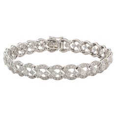 We are pleased to present this stunning 18k White Gold & Diamond Contemporary Art Deco Bracelet. It features an estimated 2.75ctw H-I/SI1-SI2 round brilliant cut diamonds all securely set in this breathtaking 18k white gold contemporary art deco inspired bracelet with push button and safety clasp. The bracelet will fit a wrist up to 7″ wrist. It is in excellent condition with very few signs of wear. This is a truly stunning piece! Please feel free to message us with any questions, we’re happy to help! Contemporary Art Deco, Art Deco Bracelet, Art Deco Inspired, Inspiration Art, Round Brilliant Cut Diamond, Push Button, White Gold Diamonds, Round Brilliant, Diamond White