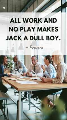 a group of people sitting around a wooden table with a quote on it that says, all work and no play makes jack a dull boy