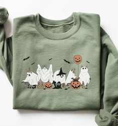 These unisex cozy sweatshirts (we use Gildan) are printed with a cute Halloween themed raccoons in ghost costume graphic 😀 * 50% cotton, 50% polyester * Pre-shrunk * Classic fit * 1x1 athletic rib knit collar with spandex * Air-jet spun yarn with a soft feel and reduced pilling * Double-needle stitched collar, shoulders, armholes, cuffs, and hem SIZING: Please ensure you check measurement chart before ordering as shirts are printed once you place your order. Sweatshirts are unisex sizes but the Cute Cartoon Print Sweatshirt For Fall, Cute Halloween Sweatshirt With Letter Print, Green Cartoon Print Sweatshirt For Fall, Novelty Long Sleeve Sweatshirt, Cute Cartoon Print Fall Sweatshirt, Funny Print Sweatshirt For Fall, Cute Fall Sweatshirt With Character Print, Halloween Crew Neck Sweatshirt For Loungewear, Halloween Cotton Sweatshirt For Loungewear