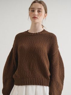 This is a minimal and modern top by VLETI that is made out of high quality and sturdy material. With distinctive mood of the design and comfortable wear, you can style it for your casual daily outfit.- Regular silhouette and round neckline- Boucle fabric with high air permeability- Minimal and feminine mood Brown Textured Knit Crew Neck Top, Modern Everyday Sweater For Fall, Modern Sweater For Everyday Fall Wear, Brown Top With Ribbed Cuffs For Fall, Brown Tops With Ribbed Cuffs For Fall, Oversized Brown Sweater With Ribbed Cuffs, Casual Brown Crew Neck Knit Top, Brown Knit Tops For Work, Brown Cotton Sweater For Workwear