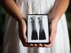 Black Silver tassel earrings BOHO earrings Long statement earrings Beaded fringe earrings Dangle swarovski earrings Ombre tassel earringsShiny and sparkling, really impressive looking earrings! Crystal white Swarovski crystals and glass seed beads combination creates a lasting impression. These earrings are perfect for your party, whether it's a wedding, birthday, or maybe just an amazing day today! The earrings are available in three length:1★ Earrings length ~ 3 inches (7,5 cm)2★ Earrings leng Ombre Fringe Earrings, Silver Tassel Earrings, Beaded Fringe Earrings, Beaded Tassel Earrings, Earrings Beaded, Crystal Stud Earrings, Beaded Fringe, Swarovski Earrings, Earrings Long