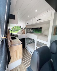 the interior of a camper with bunk beds