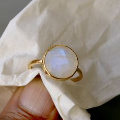 Rainbow Moonstone gold ring, 14k yellow gold Moonstone ring, Moonstone jewelry, beautiful gold ring, gift for her, Round check cut stone The 14K yellow solid gold bezel and solid yellow gold ring are both shined to an extremely high polish. All rings are packaged and shipped in a beautiful ring box. The main stone is natural, fire, Rainbow Moonstone. Gemstone Size Approx : 12 mm The pictures have been enlarged to show the details. The price is for a 14k gold ring, if you want to order the ring in 18k or 22k gold please convo me prior to purchase. PLEASE NOTE: This gold jewelry is custom made order jewelry so its possible to some slightly change in stone color,Weight and its pattern to receive your actual items but its quality and grade always high and same as described. GOLD Jewelry is not White Moonstone Celestial Ring In 14k Gold, White Celestial Moonstone Ring In 14k Gold, Celestial White 14k Gold Rings, 14k Gold Moon Phase Rings, Elegant 14k Gold Moon Phase Ring, Moon Shaped 14k Yellow Gold Rings, Gold Moonstone Ring In 14k Gold, Handmade 14k Yellow Gold Moonstone Ring, Gold Moonstone Ring With Bezel Setting For Gift