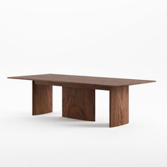 a wooden table sitting on top of a white floor