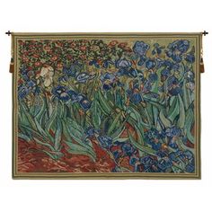 a tapestry hanging on the wall with flowers and leaves in blue, green and red colors