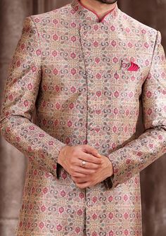 Ready-Made Sherwani With Trouser. All Over Jacquard Brocade Style Printed Fabric Top. Art Dupion Aligarhi Ready Made Trouser. Crafted in Chinese Collar Neck, and Full Sleeve. Satin Lining with Plain Work. High-Quality Matching Buttons. Please Note: The footwear shown in the picture is for presentation and photography purpose only. Color: There might be slight color variation due to lightings and flashes while photo shooting. The color may also vary because of different screen resolutions. Wash C Semi-stitched Jamawar Sets With Motifs, Traditional Long Sleeve Pink Bandhgala, Traditional Pink Long Sleeve Bandhgala, Festive Multicolor Straight Kurta Bandhgala, Traditional Unstitched Suit For Formal Festivals, Festive Pink Long Sleeve Bandhgala, Traditional Fitted Suit For Ceremonial Occasions, Formal Pink Nehru Jacket With Zari Work, Traditional Formal Unstitched Sets