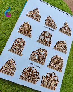 an open notebook with intricate designs on it