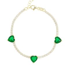 Light up your love in lush emerald and celestial jewels. Our Emerald Hearts Trifecta Bracelet brings a little glamour into your everyday, capturing the essence of sweetness and radiance in its trio of love gems strung on a strand of perfect crystals. Wear with our Oasis Emerald Heart Choker to elevate your sweetheart style to a love supreme. 14k gold plated sterling silver Crystal clear pavé and emerald stones 6-7" Adjustable in length Green Heart-shaped Jewelry Gift For Her, Emerald Jewelry With Heart Charm As Gift, Green Promise Jewelry For Valentine's Day, Green Heart-shaped Promise Jewelry, Green Heart-shaped Jewelry For Promise, Green Cubic Zirconia Heart Cut Jewelry, Green Heart Beads Bracelet, Green Heart Beads Bracelet Jewelry, Green Heart-shaped Jewelry For Party