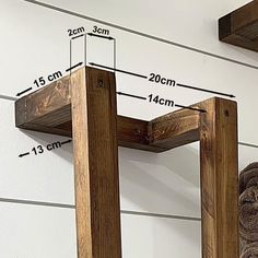 a wooden shelf with measurements for the top and bottom