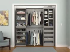 an open closet with clothes and shoes on shelves next to a gray chair in the corner