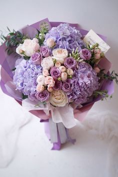 a bouquet of purple and white flowers