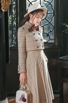 Cropped tweed knit jacket with a double breasted button up front, rounded collar, puff shoulders and pin-on bow detail. Matching dress available: Milky Plaid Tweed Button Up Dress. S: 14.5" across shoulders, 34" chest, 30" waist, 15" lengthM: 15" across shoulders, 35.5" chest, 31.5" waist, 15" lengthL: 15.5" across shoulders, 37" chest, 33" waist, 15.5" lengthXL: 16" across shoulders, 38.5" chest, 34.5" waist, 15.5" length Beige Long Sleeve Tweed Jacket For Semi-formal Occasions, Winter Long Sleeve Tweed Dress With Buttons, Formal Fall Tweed Dress With Buttons, Fall Formal Tweed Dress With Buttons, Semi-formal Beige Long Sleeve Tweed Jacket, Formal Long Sleeve Tweed Dress With Button Closure, Beige Button-up Tweed Jacket For Fall, Fall Long Sleeve Single Breasted Tweed Dress, Single-breasted Long Sleeve Tweed Dress